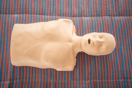 Cardiopulmonary resuscitation simulator is on the floorの写真素材