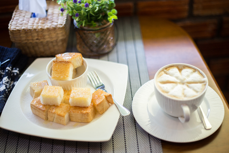 foam coffee with toastの写真素材