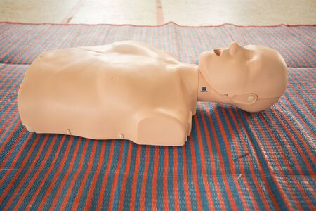 Cardiopulmonary resuscitation simulator is on the floorの写真素材