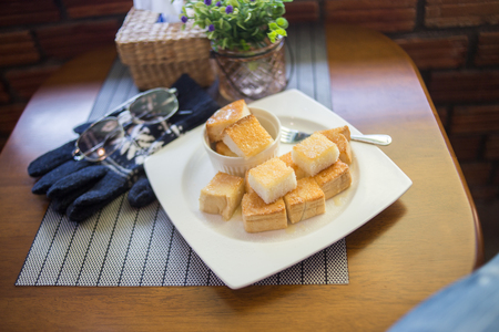 toast bread bake with honey on the plateの写真素材