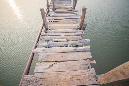 wood bridge cross a riverの写真素材