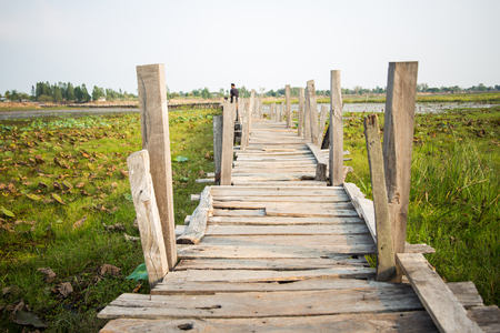 wood bridge cross a riverの写真素材