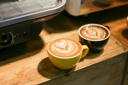 Heart coffee on table in cofee barの写真素材