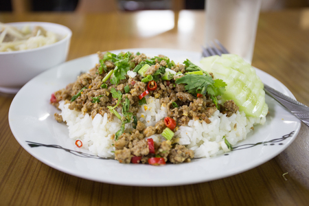 spicy minced meat salad with riceの写真素材