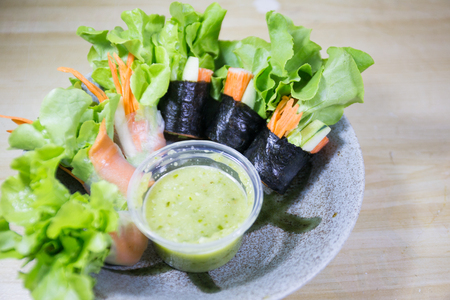 salad row with sea food sourceの写真素材