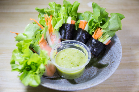 salad row with sea food sourceの写真素材