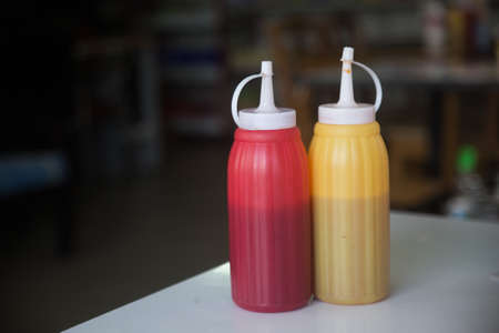 Tomato sauce with mustard  on the white table.の写真素材