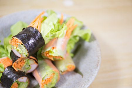 Fresh vegetable salad rolls on the table.の写真素材