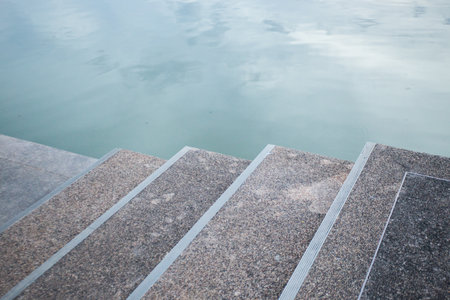 A river bank is the land along the edge of a river.の写真素材