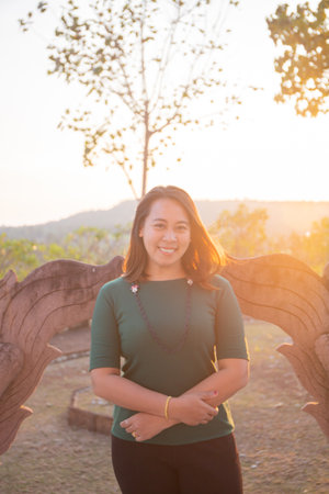 asian women is smile on the sunset.の写真素材