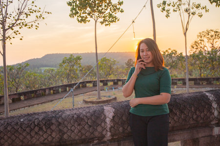 asian women is smile on the sunset.の写真素材