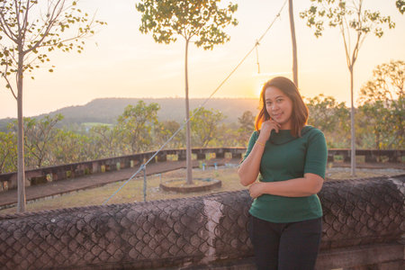 asian women is smile on the sunset.の写真素材