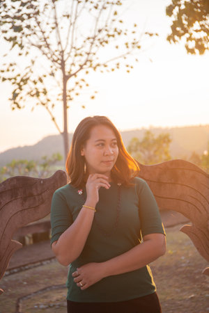 asian women is smile on the sunset.の写真素材
