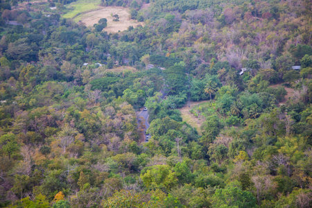 Mountain roads can vary greatly in size and complexity, from narrow dirt paths to multi-lane highways. They may be paved or unpaved, and may include features such as switchbacks, hairpin turns, and steep grades.の写真素材