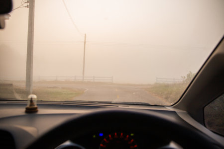 View on the road from inside the car with driver on the road.の写真素材