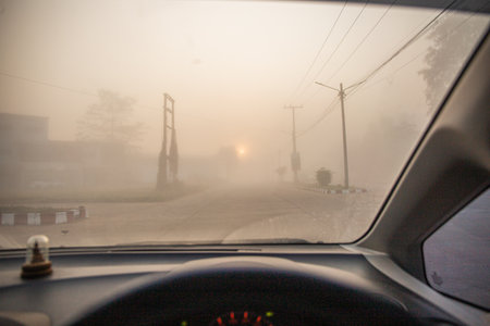 View on the road from inside the car with foggy background.の写真素材