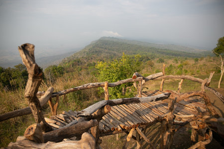 A photo of a wooden fence along a mountain pathの写真素材