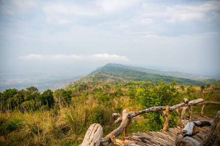 A photo of a wooden fence along a mountain pathの写真素材