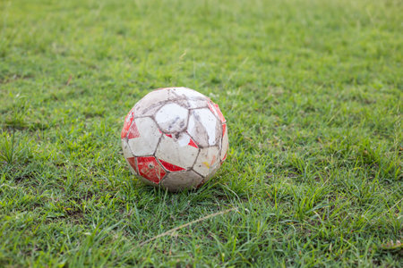 Soccer ball on the old soccer field. yard football. close-upの写真素材