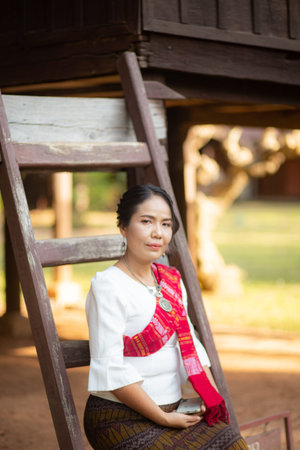 Women in northeastern Thailand wearing traditional costumes on important occasions.の写真素材