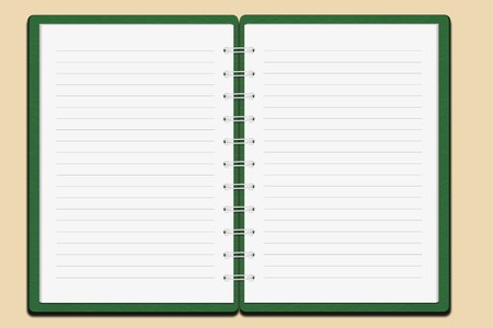 Green cover notebook on color backgroundの写真素材