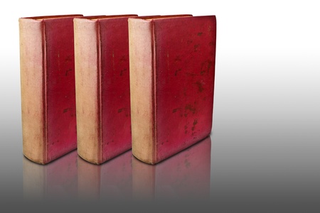 Three red books on reflected floor の写真素材