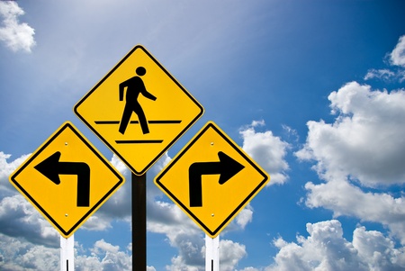 A man walking sign and turn sign with cloudy skyの写真素材