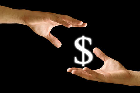 Seller hand take the Dollar icon from the buyer handの写真素材