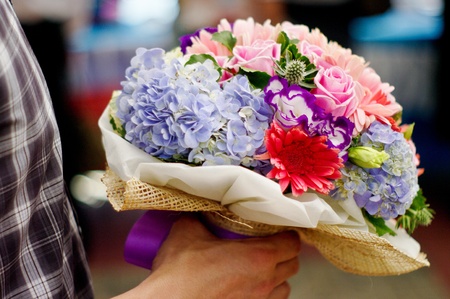 Flower in the hand for sweet lover.の写真素材