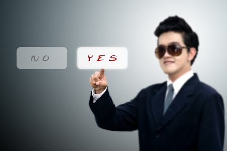Young Asian business man pushed yes button, Business conceptの写真素材