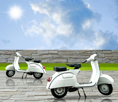 White motorbike on the decorate stone floor with nice skyの写真素材