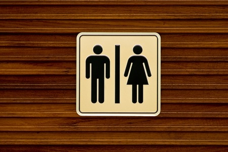 Toilet sign on wooden wall