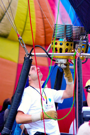 CHIANG MAI, THAILAND - NOV 25 : Unidentified man to prepare the faucet gas of balloon on Nov 25, 2011 at Prince Royal's College in Chiang Mail, Thailand International Balloon Festival 2011のeditorial素材