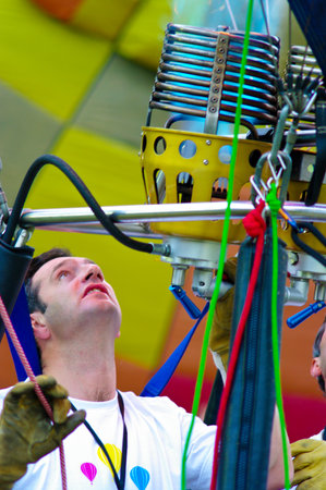 CHAING MAI, THAILAND - NOV 25 : Unidentified man to prepare the faucet gas of balloon on Nov 25, 2011 at Prince Royal's College in Chiang Mai, Thailand International Balloon Festival 2011のeditorial素材