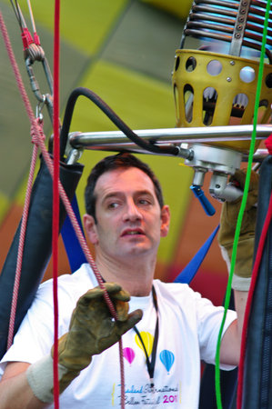 CHIANG MAI, THAILAND - NOV 25 : Unidentified man to prepare the faucet gas of balloon on Nov 25, 2011 at Prince Royal's College in Chiang Mai, Thailand International Balloon Festival 2011のeditorial素材