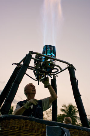 CHIANG MAI - NOV 26: Unidentified pilot testing burner of Hot air balloon during Thailand balloon festival 2011 at Prince Royal college in Chiang mai, Thailand on Nov 26, 2011.のeditorial素材
