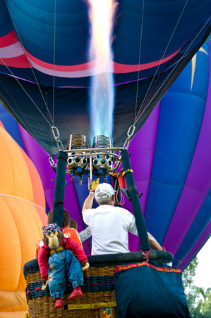 CHIANG MAI, THAILAND - NOV 26 : Participants blow up their balloons in the International Balloon Festival on November 26,2011 at the Prince Royals College in Chiang Mai Thailand.のeditorial素材