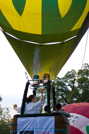 CHIANG MAI, THAILAND - NOV 26 : Participants blow up their balloons in the International Balloon Festival on November 26,2011 at the Prince Royals College in Chiang Mai Thailand.のeditorial素材