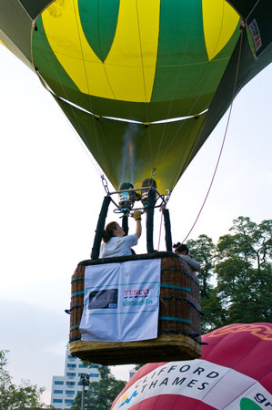 CHIANG MAI, THAILAND - NOV 26 : Participants blow up their balloons in the International Balloon Festival on November 26,2011 at the Prince Royals College in Chiang Mai Thailand.のeditorial素材