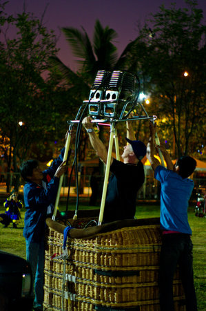 CHIANG MAI, THAILAND - NOV 27 : Unidentified man prepare balloon during Thailand international balloon festival 2011 at Prince Royal's college in Chiang Mai, Thailand on Nov 27, 2011.のeditorial素材