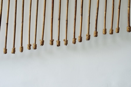 Abstract art moblie hanging beside wallの写真素材