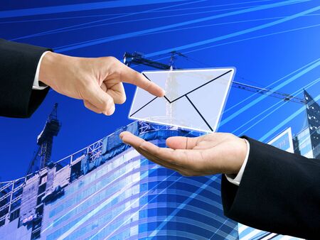 Boss order pass the email with construction site backgroundの写真素材