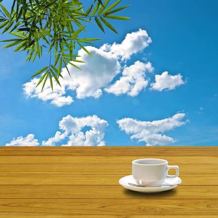 Hot coffee on table with nice blue skyの写真素材