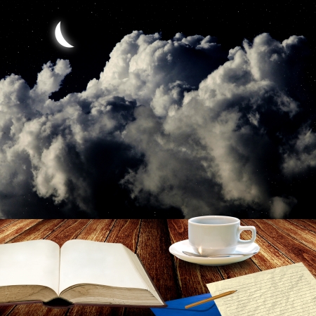 Open book and drink coffee at night for write letterの写真素材