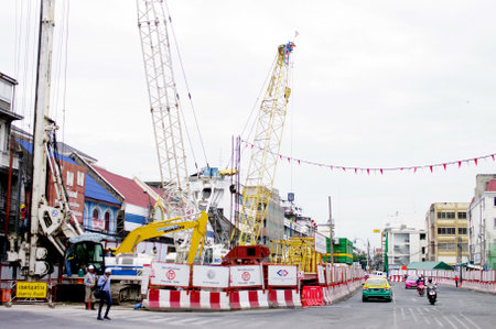 BANGKOK, THAILAND - AUGUST 31 : Machinery working for build subway station on 31 August 2012 at Wang-Burapa junction, Bangkok, Thailandのeditorial素材