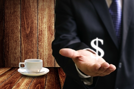 Businessman make money from coffee businessの写真素材