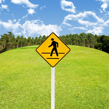 Crossroad sign with green golf course backgroundの写真素材
