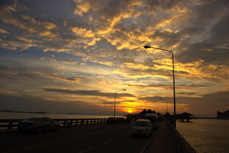 CHONBURI, THAILAND-AUGUST 28 : Car park on bridge for see nice sunset sky on August 28,2012 in Kho Loy islands, Chonburi, Thailandのeditorial素材