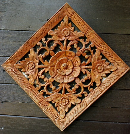 Flower carving art on wooden wall, Retro art in Thailandの写真素材