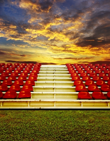 Red bleachers with sunset sky backgroundの写真素材